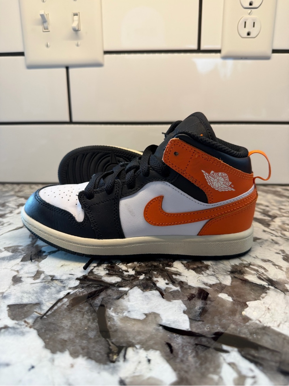 Jordan Kids Mid-Top Sneakers in Black White and Orange